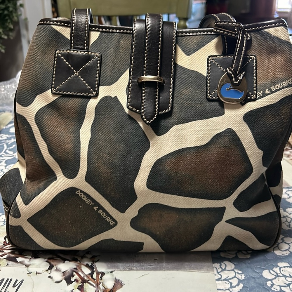 Very nice Dooney & Bourke Giraffe set has vintage look on both.